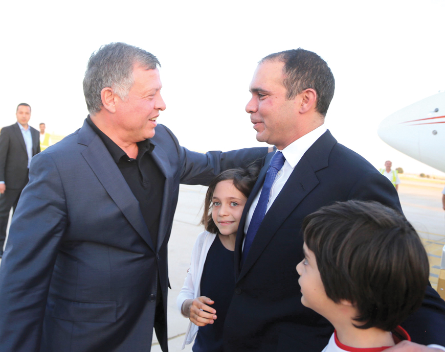 His Majesty King Abdullah receives HRH Prince Ali upon his arrival on Sunday from Geneva, where he competed for the FIFA presidency (Photo courtesy of Royal Court )